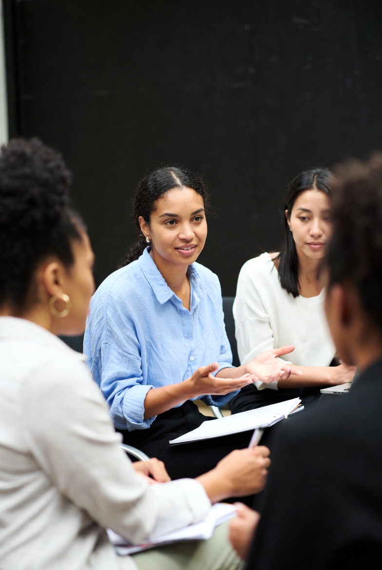 Women exchanging knowledge in a group session